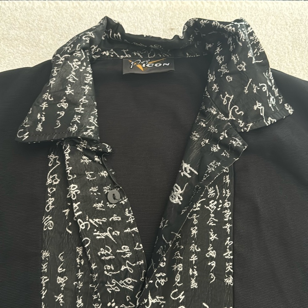 Pop Icon button down short sleeve shirt. Unsure size. See photo measurements.